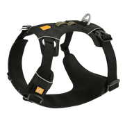 Black adjustable dog harness with metallic hardware and yellow logo patches.