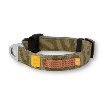 The Roam Dog Collar Green Ripple features a green camouflage pattern, black plastic buckle, orange-stitched loop, yellow logo patch, and metal leash ring.